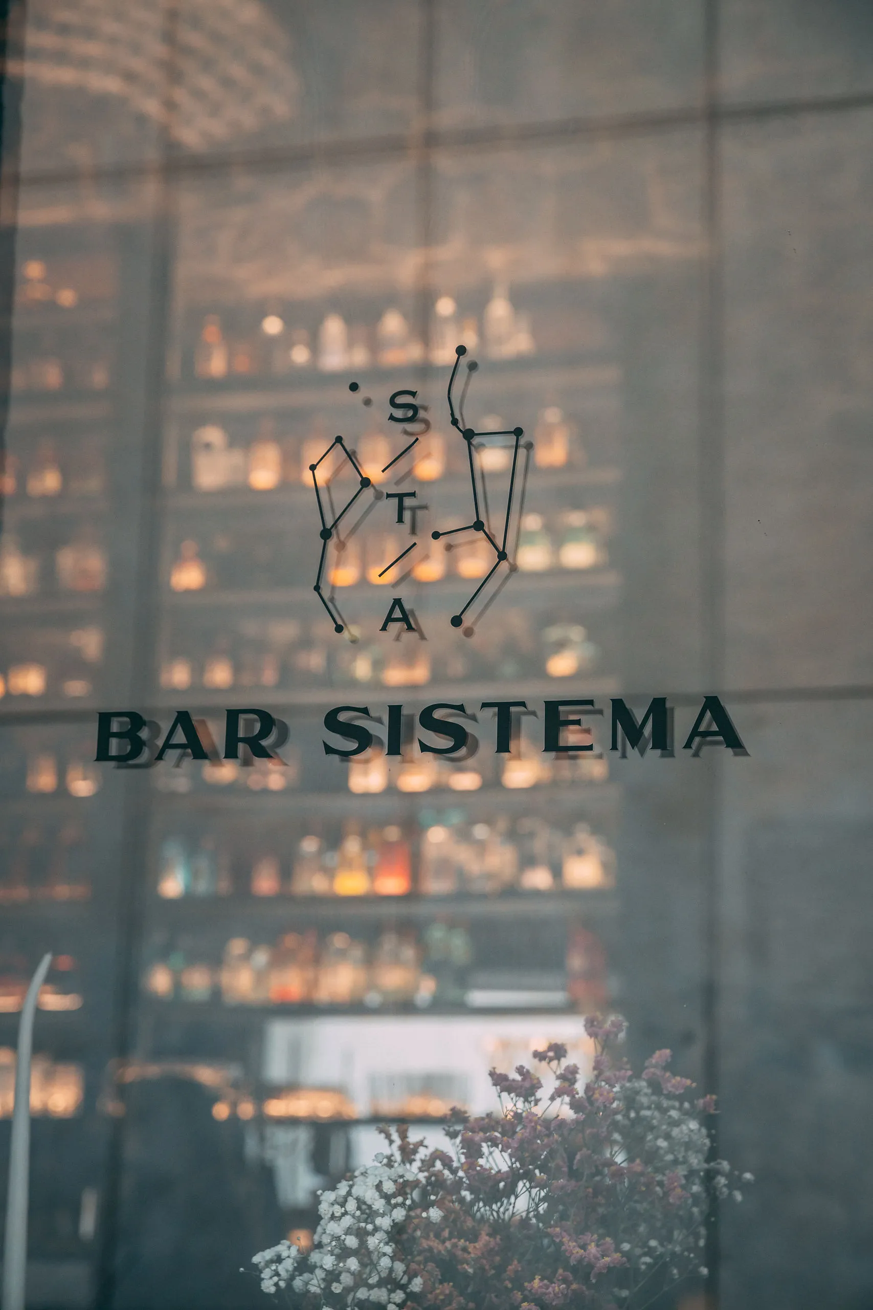 Bar Sistema window with bottle wall display in Split Old Town nightlife venue