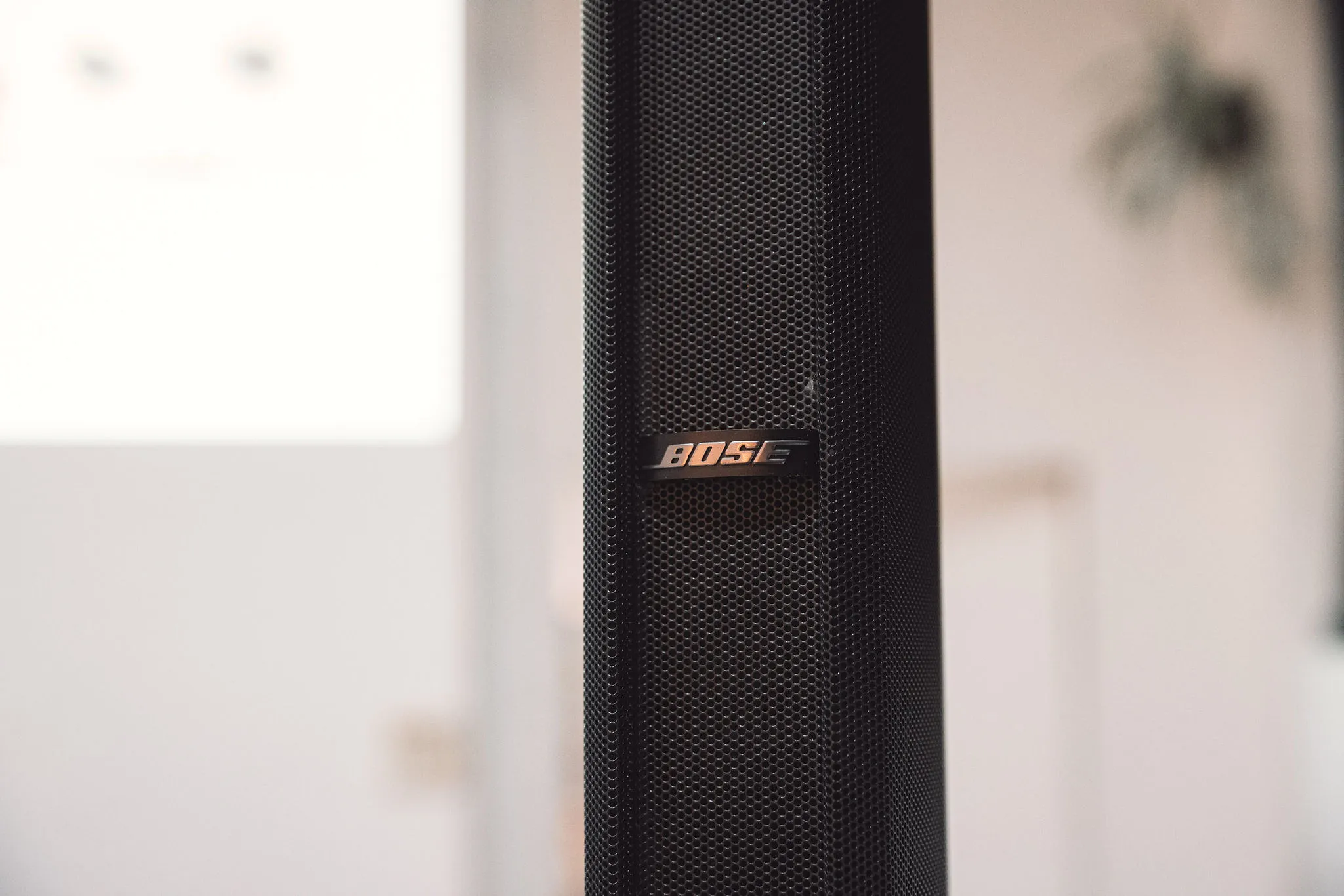 Close-up of Bose F1 speaker logo and mesh grille — professional event audio equipment