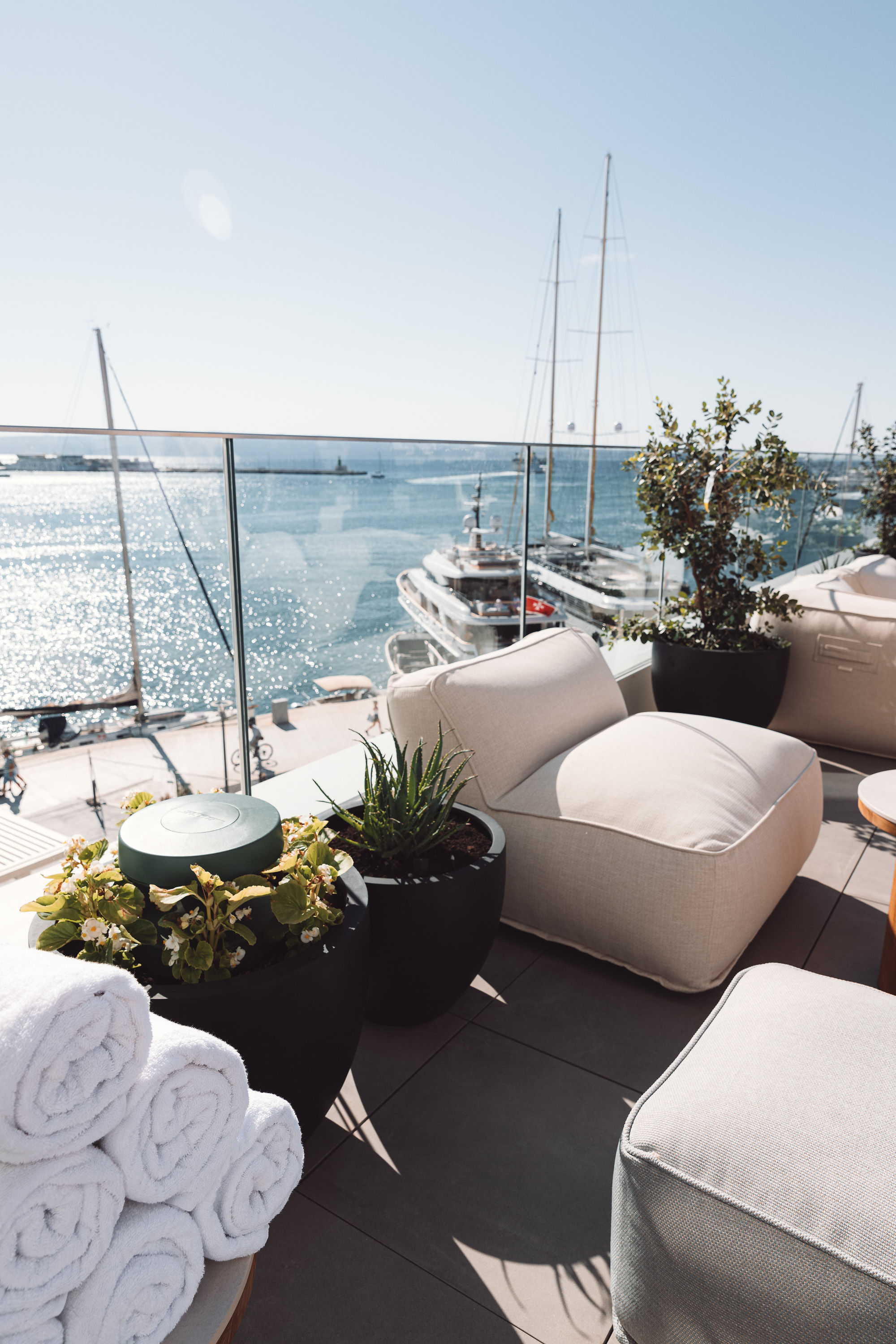 Weather-ready outdoor speaker integrated into planter landscaping beside the sea