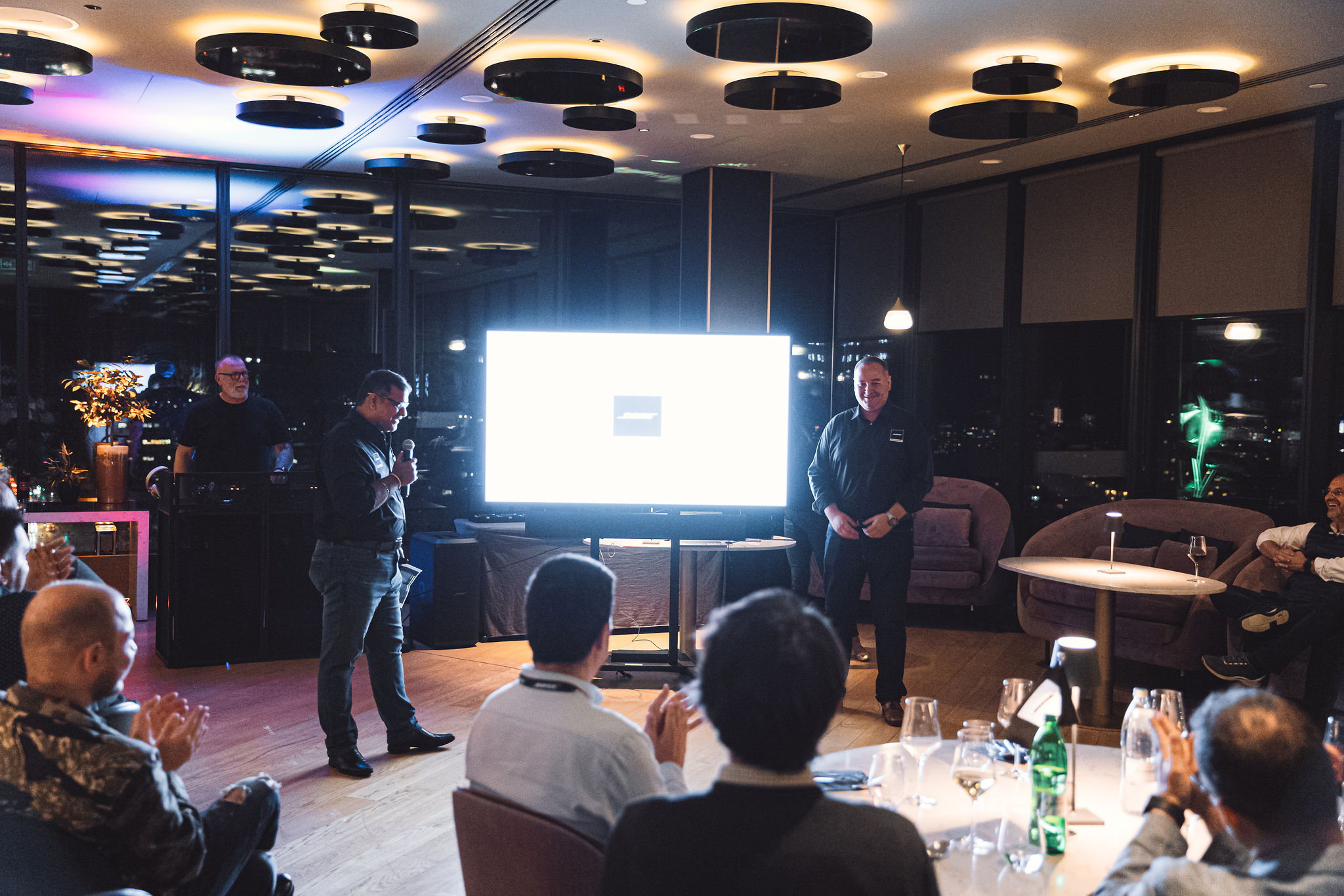 Bose Professional presenters with audience clapping at DJ booth during Ljubljana partner event