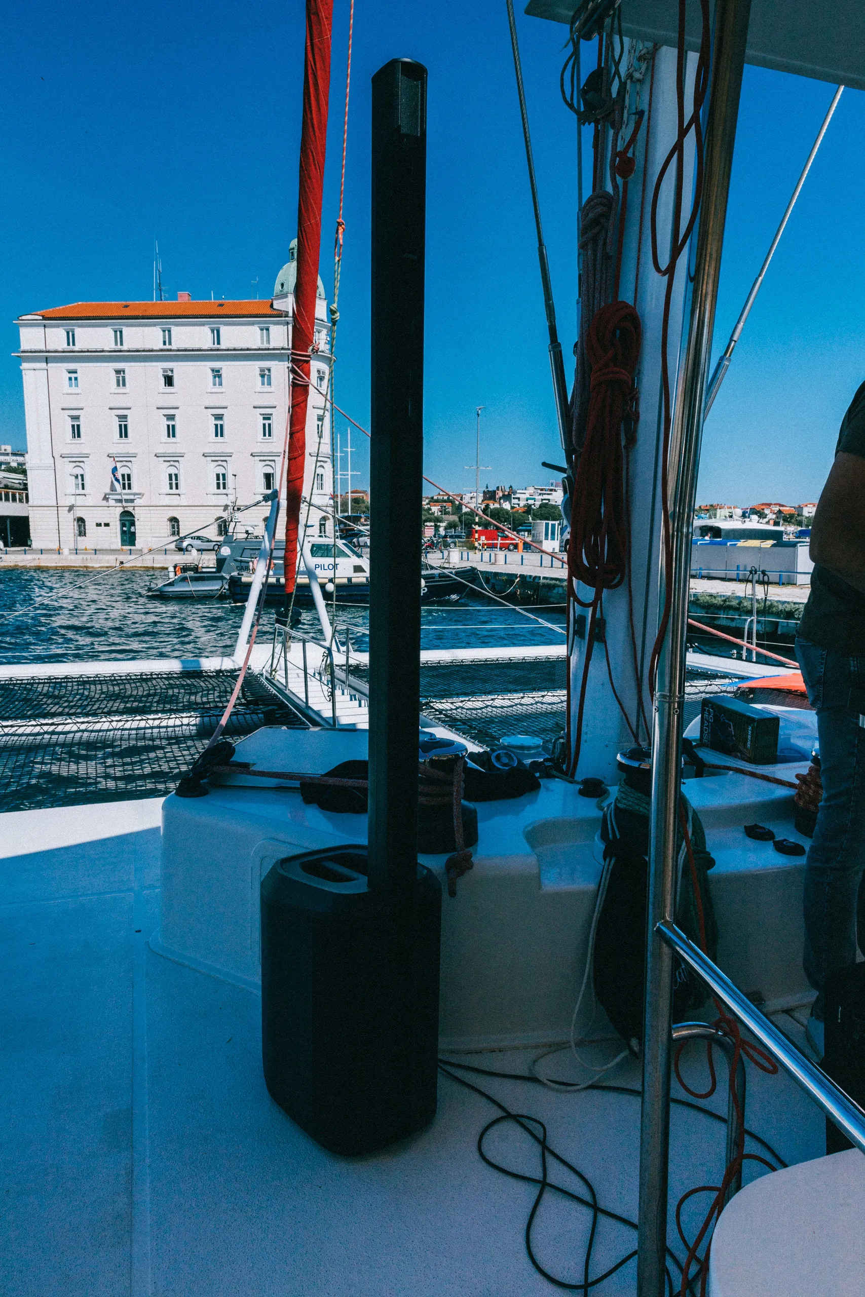 Bose speaker on catamaran deck with Split waterfront — Cosmic Production yacht event audio