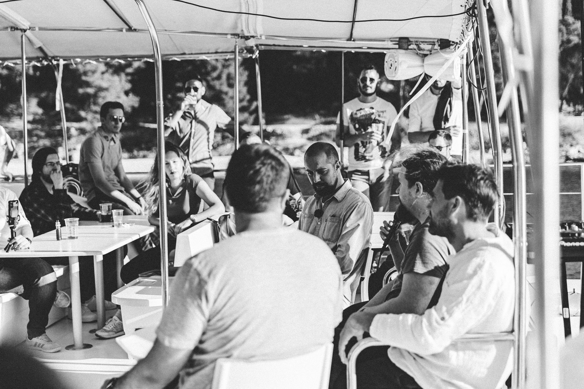 Tech meetup presentation on catamaran with seated audience, Split Tech City corporate event by Cosmic Production