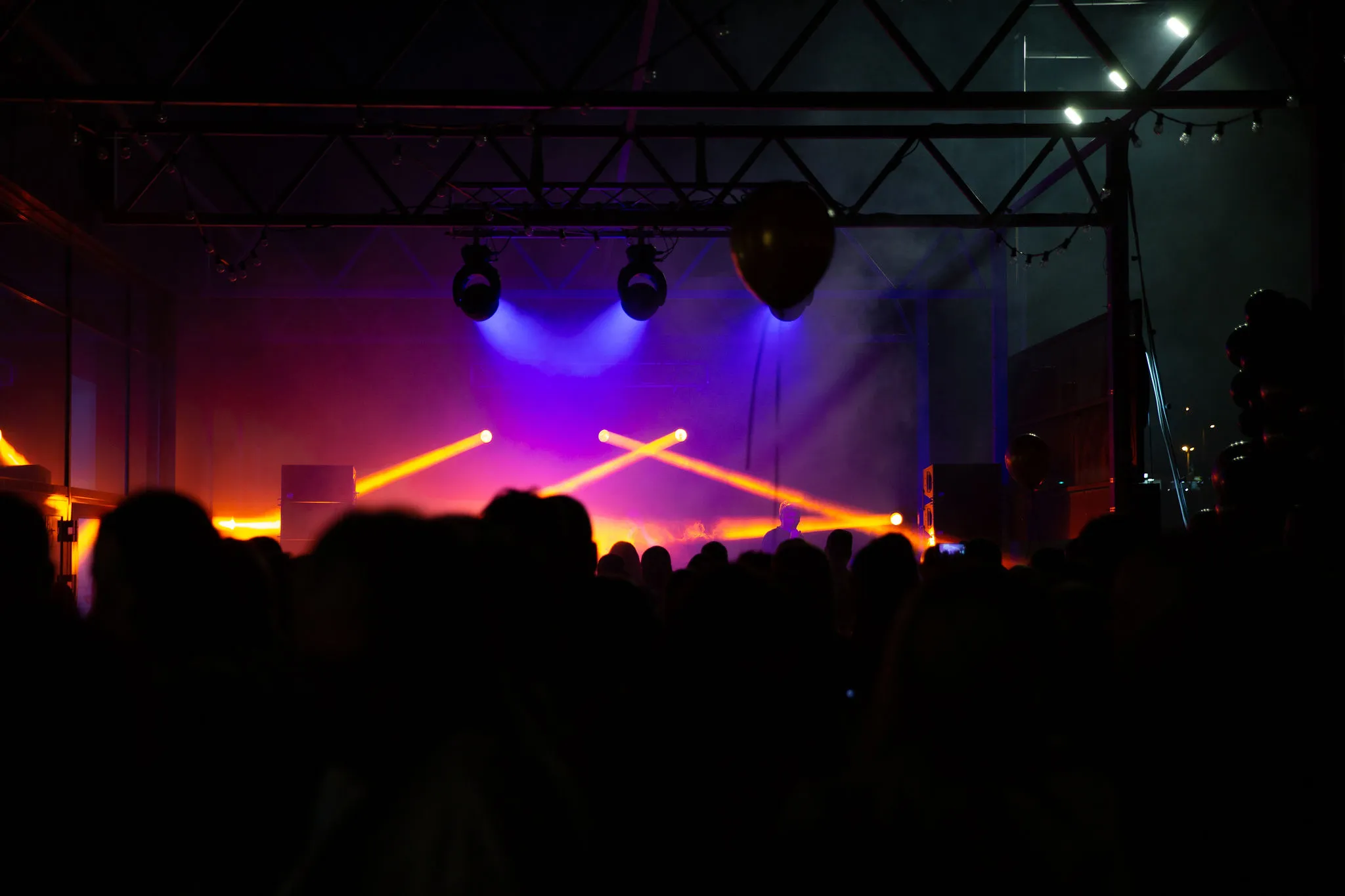 Crowd energy with hands raised at a Cosmic Production party event in Split