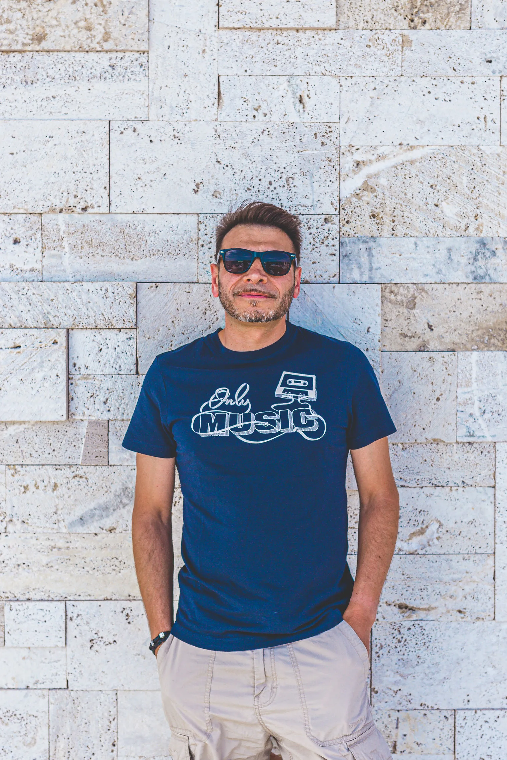 DJ Gentle Fred casual portrait with Only Music t-shirt at Mistral — Cosmic Production