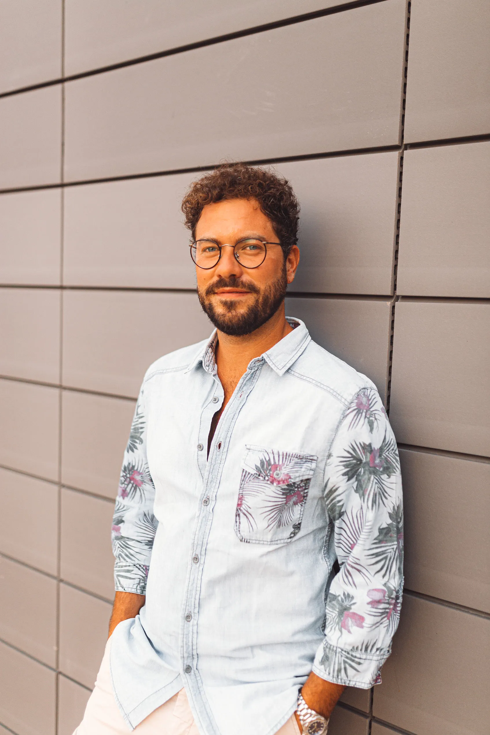 DJ Leo portrait headshot in tropical shirt — Cosmic Production DJ roster Split