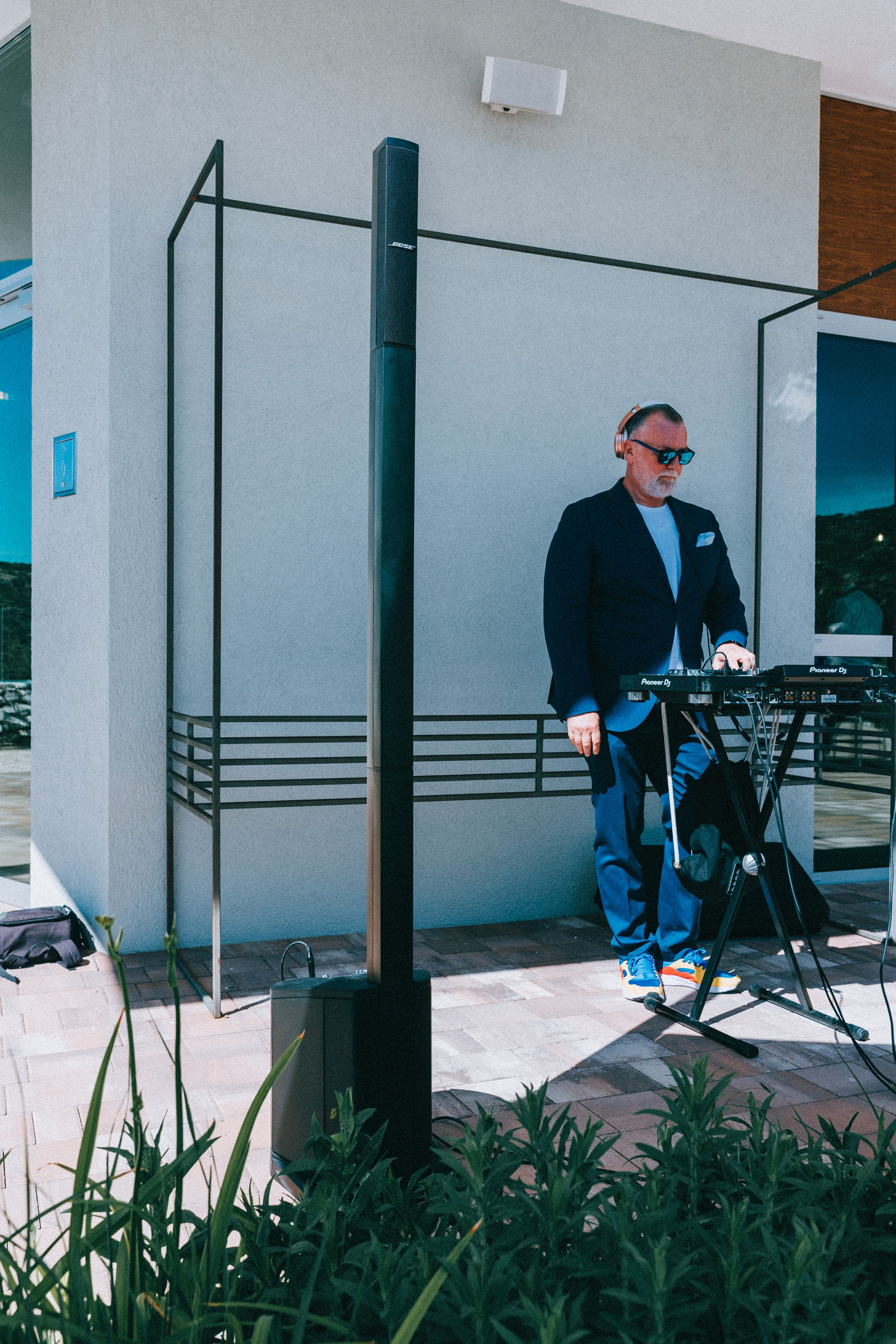 DJ Matthew Bee at Pioneer DJ controller next to Bose L1 column speaker at Stella Croatica Olive Oil Museum corporate event