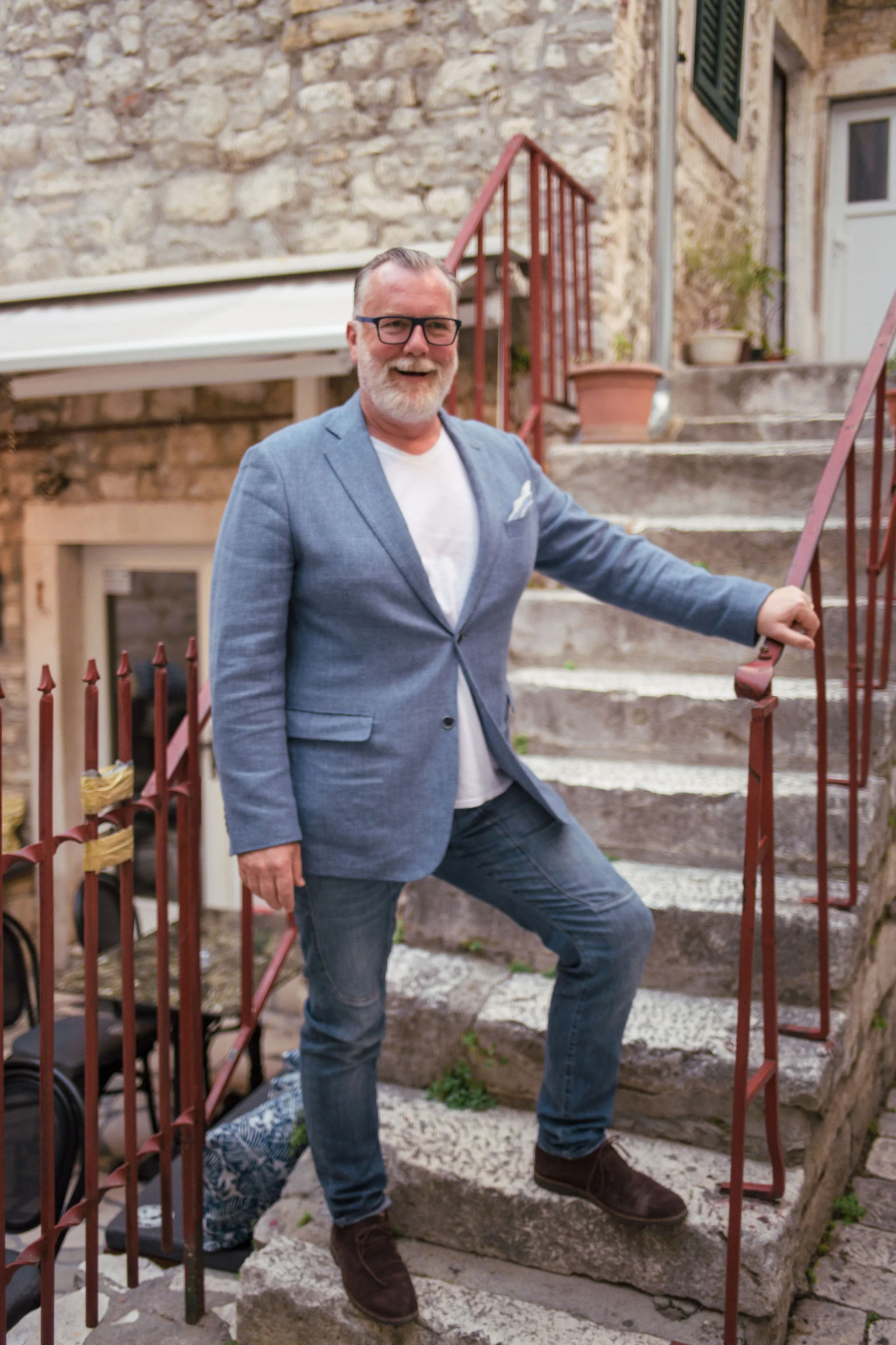 DJ Matthew Bee portrait on Croatian stone steps in Split — Cosmic Production