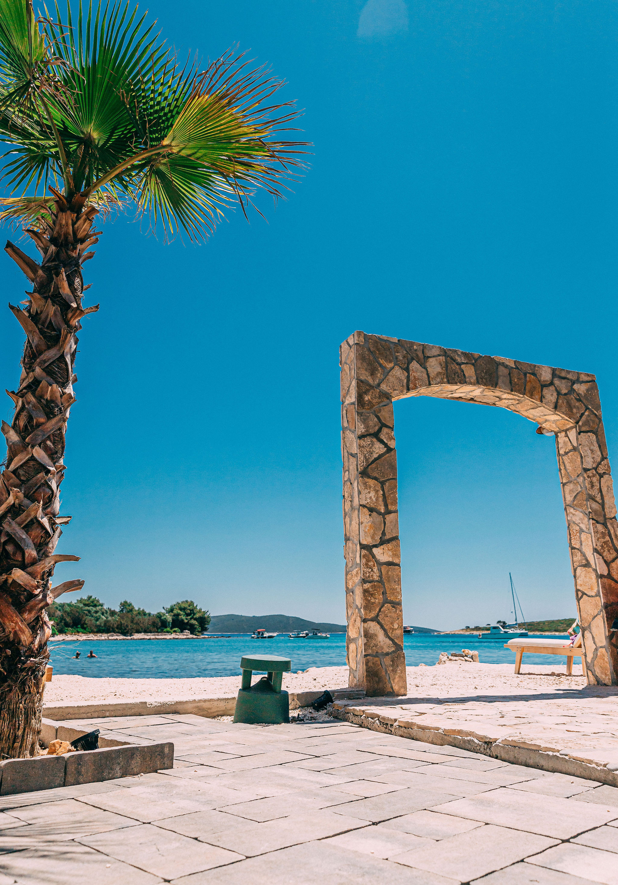 Haven Beach Bar stone archway at Blue Lagoon Croatia — venue and architectural photography