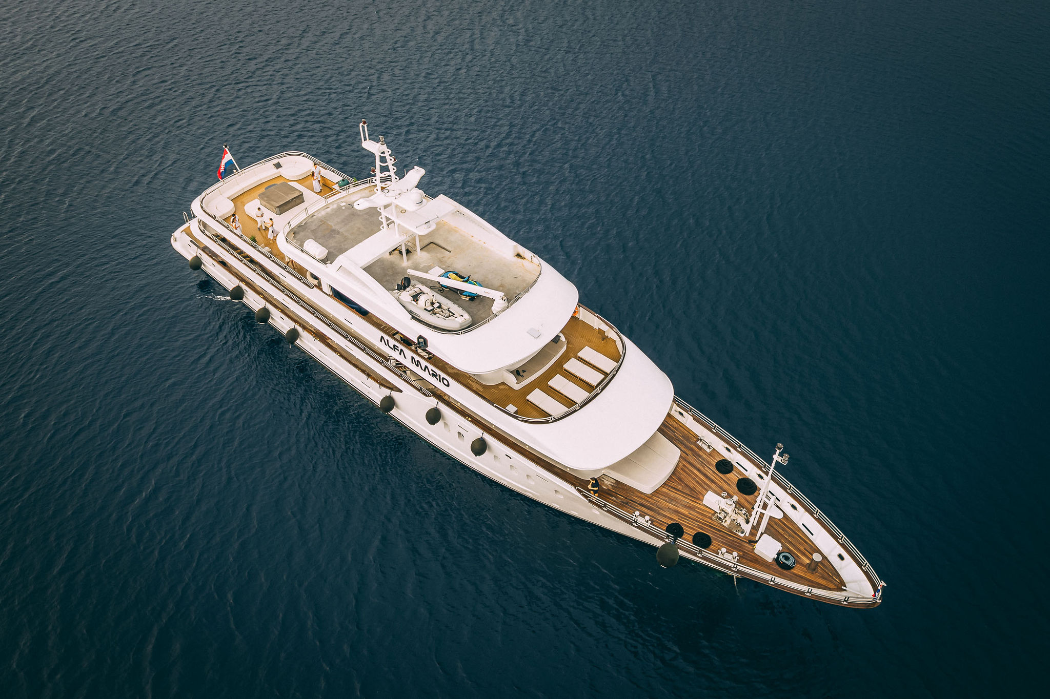 Luxury motor yacht Alfa Mario aerial drone view showing multiple entertainment zones on the Adriatic Sea