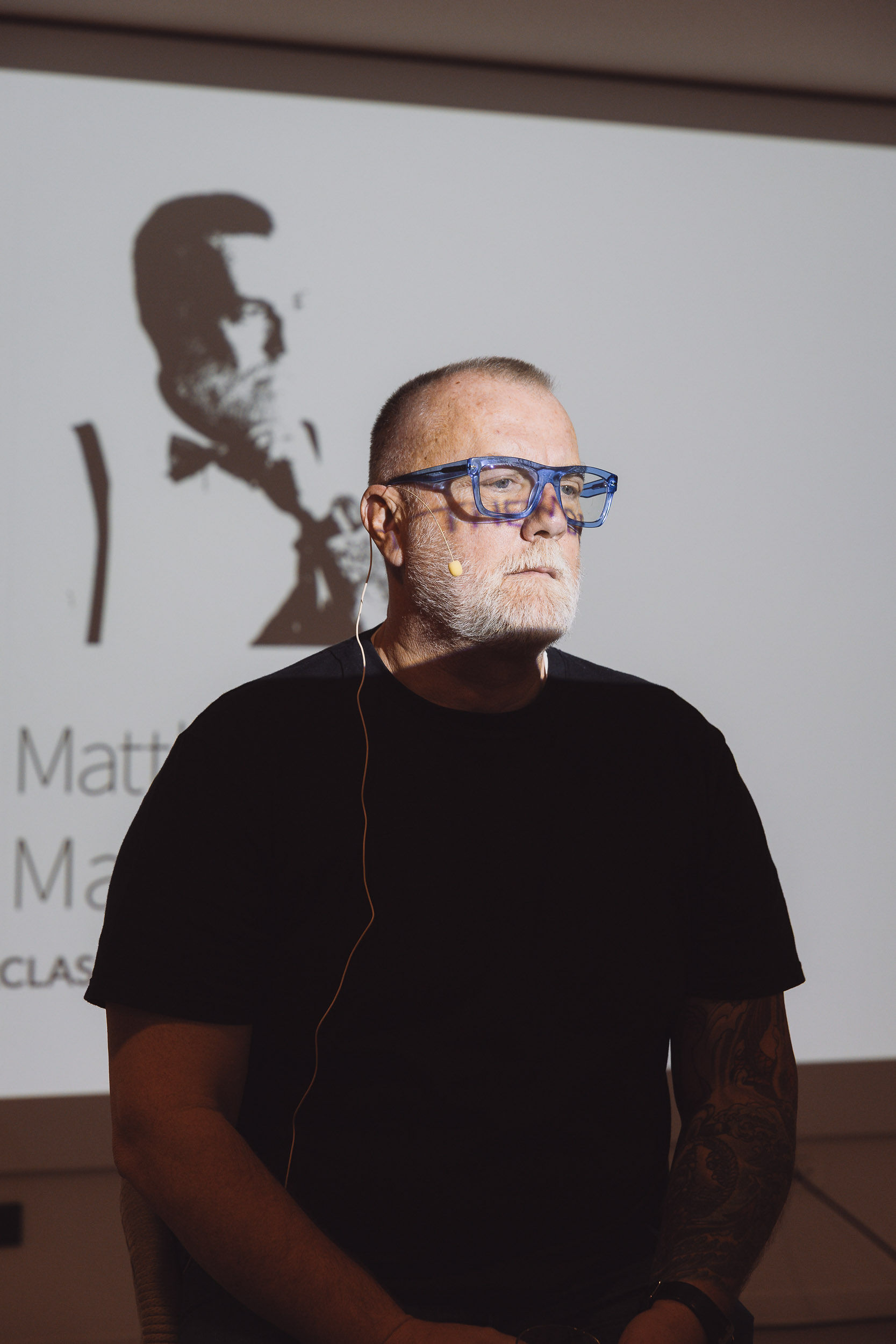 Matthew Bee as keynote speaker at DJ Masterclass, dramatic backlit portrait