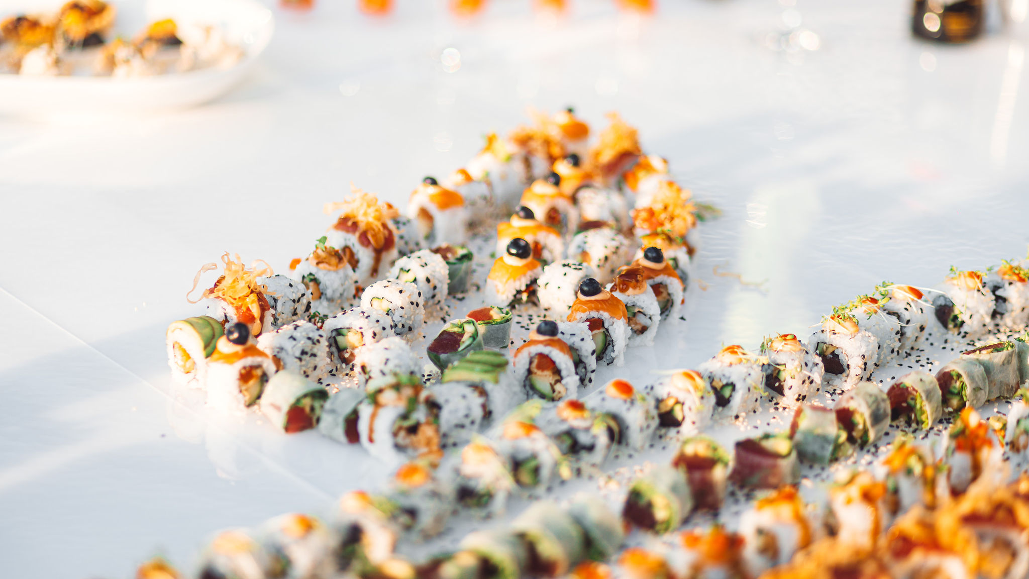Artisan sushi platter at golden hour rooftop corporate event in Split Croatia